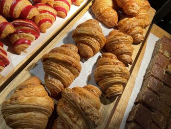 Close up group of fresh baked croissants, super delicious warm fresh buttery croissants and rolls, 