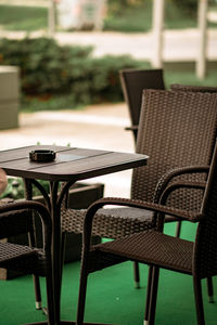 Empty chairs and tables at cafe