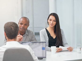 Business colleagues working at office