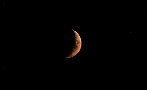 Close-up of moon over black background