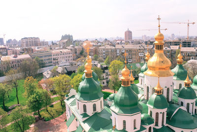 Cathedral with green cupolas in daylight from above in kiev, ukraine.
