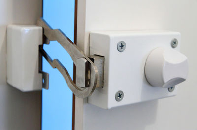 Close-up of white door lock