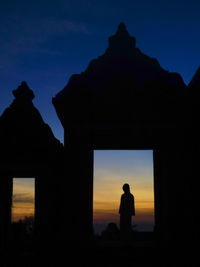 Silhouette man against blue sky during sunset