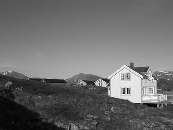 Houses against mountain range