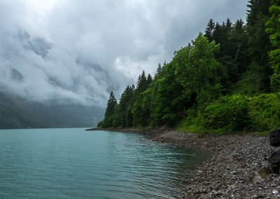 Scenic view of sea against cloudy sky