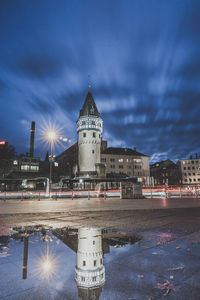 Illuminated buildings in city at night