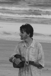Young man looking at sea