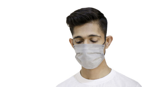 Portrait of young man against white background