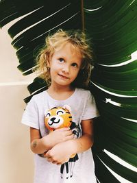 Portrait of smiling girl standing outdoors
