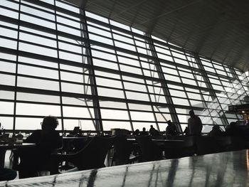 Silhouette of people at airport