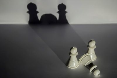 Close-up of chess pieces on table