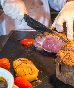 Close-up of man preparing food