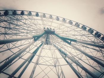 Low angle view of ferris wheel against sky