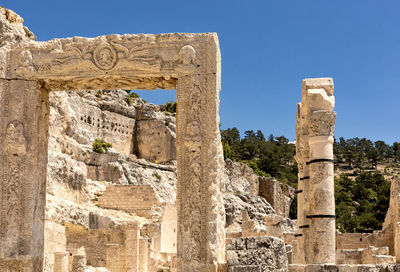 Low angle view of old ruins against sky