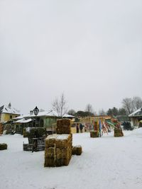 Scenic view of snow covered field against sky