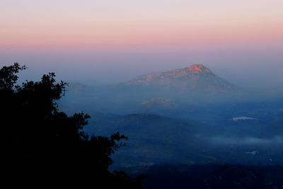 Scenic view of mountains against sky during sunset