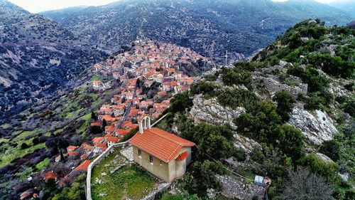 High angle view of trees and buildings in town