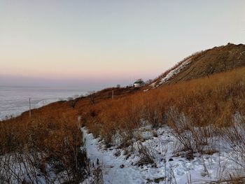 Scenic view of sea against clear sky during sunset