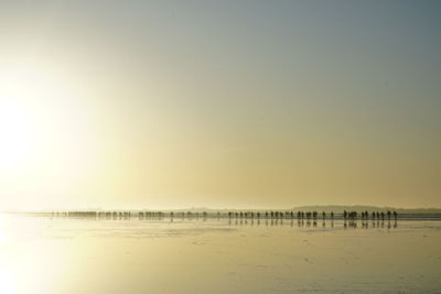 Scenic view of sea against clear sky during sunset