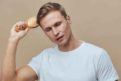 Young man holding apple