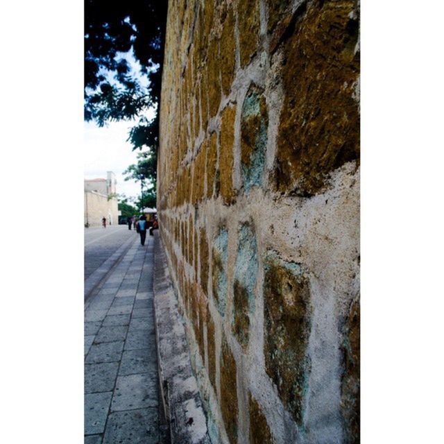 walking, men, building exterior, architecture, the way forward, built structure, lifestyles, person, street, rear view, full length, transfer print, leisure activity, transportation, road, auto post production filter, day, footpath