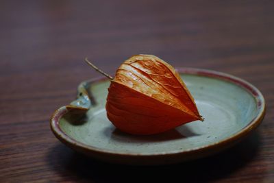 Close-up of fruit in plate on table