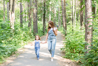 Full length of women in forest