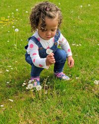 High angle view of girl on grassy field