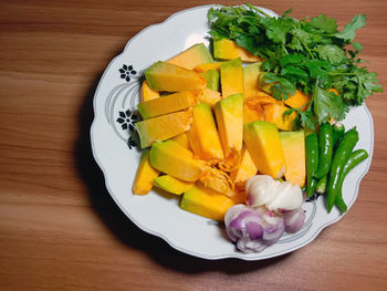 High angle view of fruits in plate on table