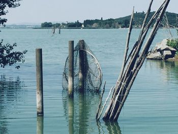 View of wooden post in water