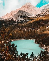 Scenic view of lake and mountains against sky