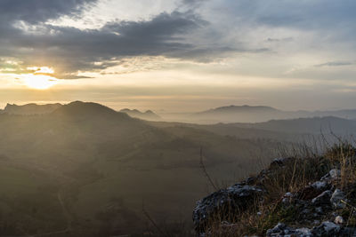 Scenic view of mountains against sky during sunset