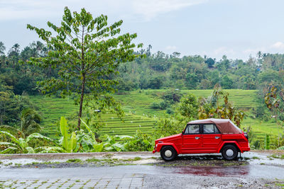 Car on landscape against sky