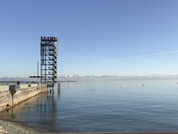 Scenic view of sea against clear blue sky