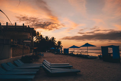 Scenic view of beach against sky during sunset