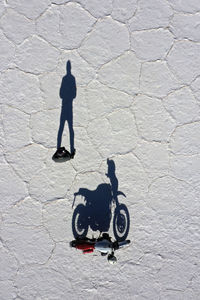 Shadow of man on street