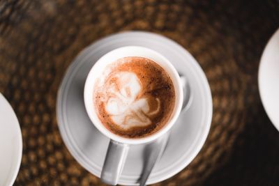 High angle view of cappuccino on table