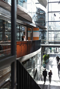 High angle view of business people discussing in atrium