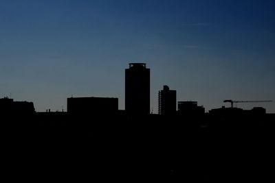 Silhouette of buildings at sunset