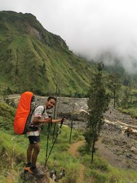 Full length of man standing on mountain