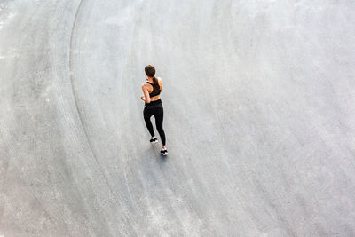 High angle view of woman running