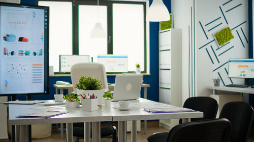 Empty chairs and table in restaurant
