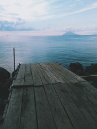 Pier over sea against sky