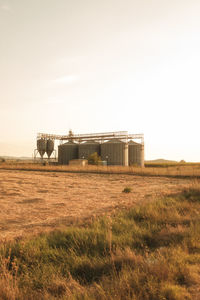 Scenic view of field against clear sky