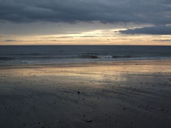 Scenic view of sea against sky at sunset