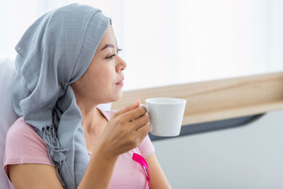 Portrait of woman drinking coffee