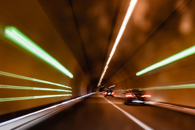 Low angle view of illuminated tunnel