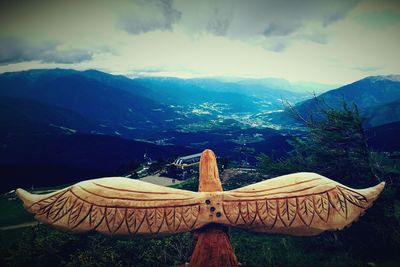 Scenic view of mountains against cloudy sky