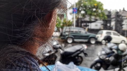 Portrait of woman on street in city