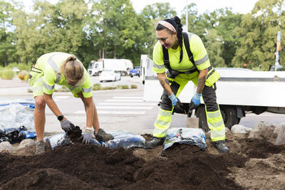 Female workers doing landscaping work